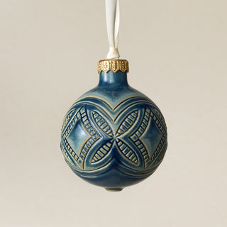 Intricately carved and glazed ceramic globe ornament with ivory satin ribbon – Ornament No. 450