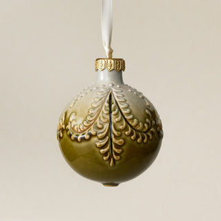 Intricately carved and glazed ceramic globe ornament with ivory satin ribbon – Ornament No. 451