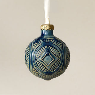 Intricately carved and glazed ceramic globe ornament with ivory satin ribbon – Ornament No. 453