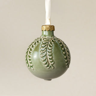 Intricately carved and glazed ceramic globe ornament with ivory satin ribbon – Ornament No. 455