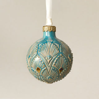 Intricately carved and glazed ceramic globe ornament with ivory satin ribbon – Ornament No. 459