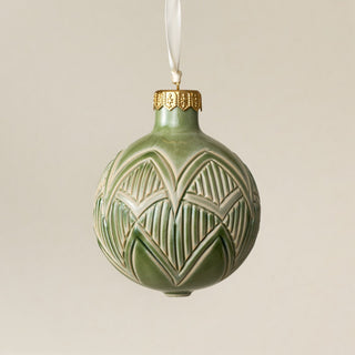 Intricately carved and glazed ceramic globe ornament with ivory satin ribbon – Ornament No. 483