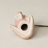 The bottom of the Queen City Pig ornament, beige ceramic base with the form number, MMXX, and the Rookwood "RP" logo