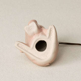 The bottom of the Queen City Pig ornament, beige ceramic base with the form number, MMXX, and the Rookwood "RP" logo