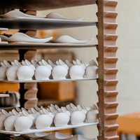 Ceramic Grove Bunnies by Rookwood Pottery on the kiln shelf