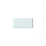 Inspired by the Alpine mountaintops, this cool neutral glaze presents a slight variation in color and features a hint of powder blue, reflective high gloss surface, and typically opaque break along relief details and tile edges.