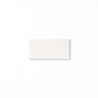 The perfect white, Annapurna is a soft alternative to a typical stark white and features a slight variation in color, a smooth matte surface texture, and presents opaque around edges and relief details. 