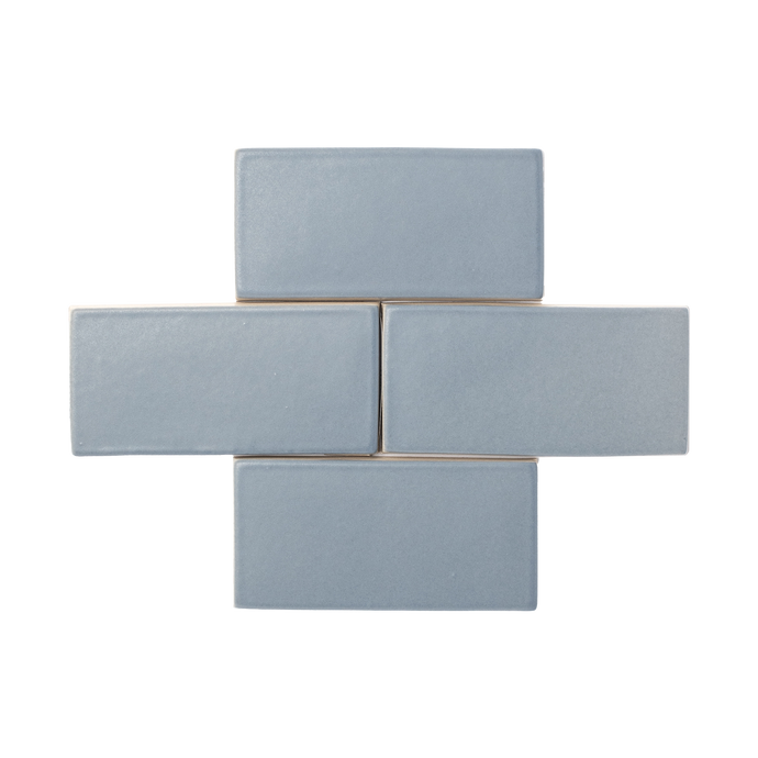 An ode to smooth stones picked from shallow waters, Beachstone is a matte glaze with a smooth surface texture that presents moderate variation in color and features an opaque break on tile edges and relief details.