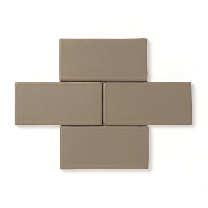 A reliable neutral green that is consistent in color, Camouflage features a smooth matte surface texture and an opaque break along tile edges and relief details.