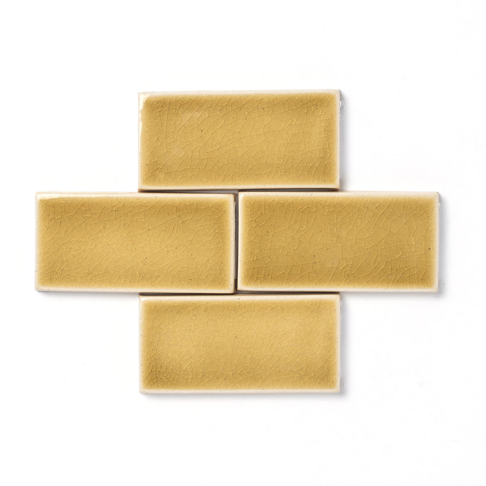 This magnificently mature yellow-gold glaze features a uniquely formed crackle surface texture, high-gloss finish, and transparent break along tile edges and relief details.