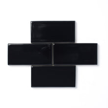 Load image into Gallery viewer, This sleek polished black glaze offers a slight variation in color, a high-gloss surface texture and an opaque break along tile edges and relief details.
