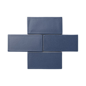 The ultimate navy blue, Orion is a smooth matte glaze that has a slight variation in color and texture and presents an opaque break on tile edges and relief details.