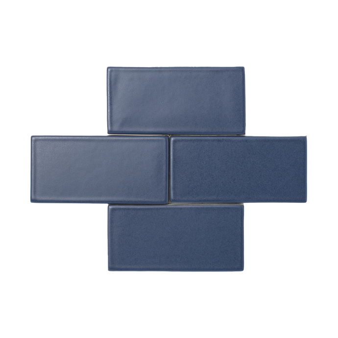 The ultimate navy blue, Orion is a smooth matte glaze that has a slight variation in color and texture and presents an opaque break on tile edges and relief details.