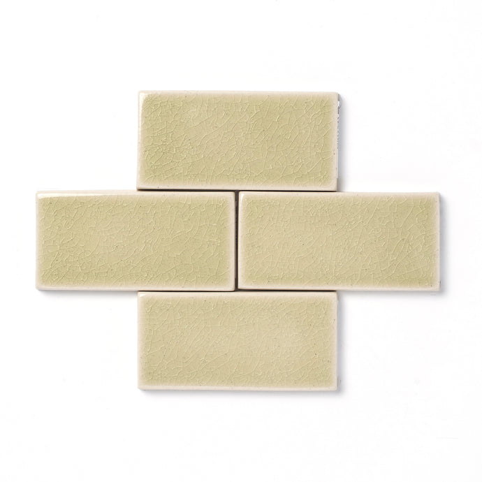 The organically formed crackle texture on this high-gloss glaze is perfectly complimented by the pale green color and transparent edge break that allows the ceramic clay body to shine through.